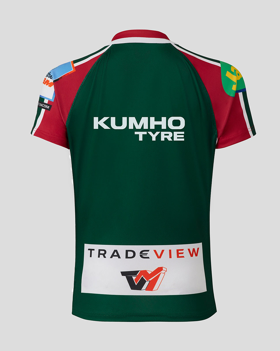 Sleeve hem showing red green and white stripes with visible stitching.