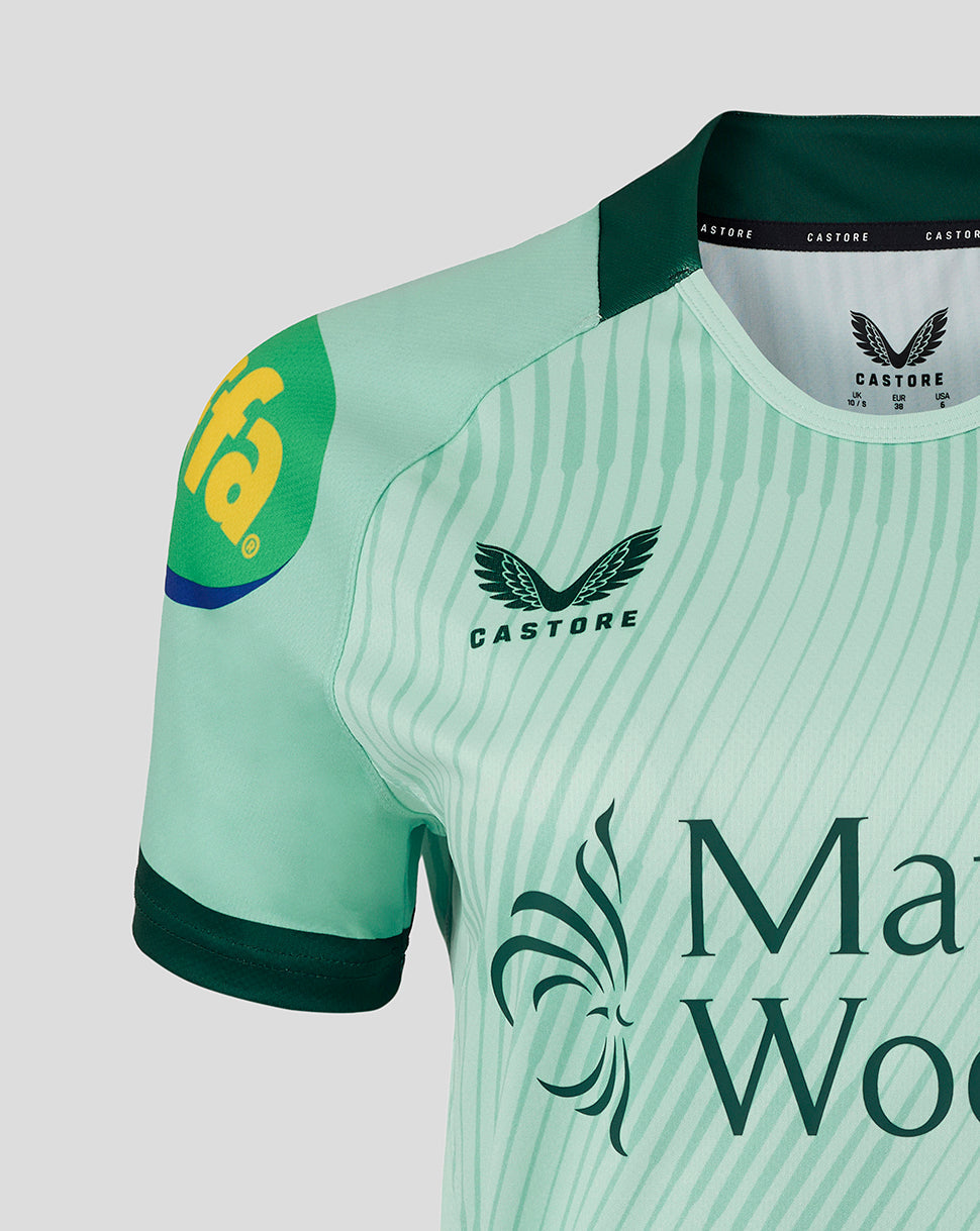 Close up of mint green Leicester Tigers replica away shirt shoulder and chest with Castore branding and Mattioli Woods.