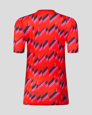 Back view of the Welsh Fire The Hundred 2026 short sleeve training T shirt featuring a bold red pink black geometric print