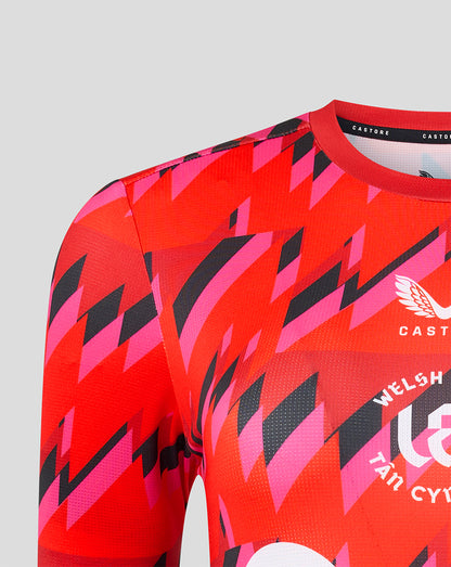 Front view of the Welsh Fire training T shirt with crest sponsor logos and Castore collar label on a red pink geometric print