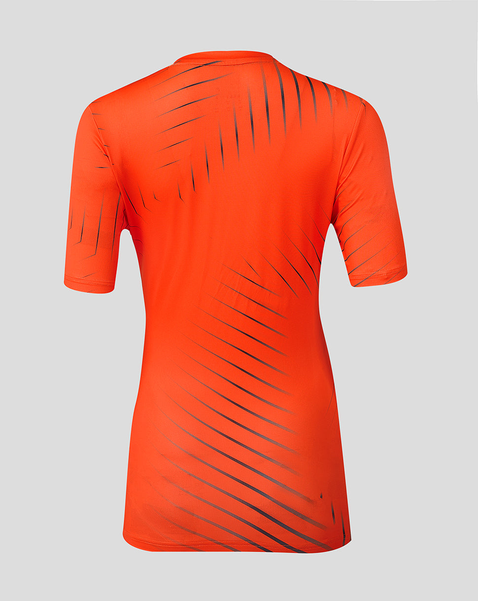 Back view of bright orange Sunrisers Leeds training T shirt with diagonal dark stripes running across the back and sleeves