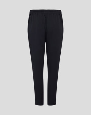 Back view of black track pants with elastic waistband