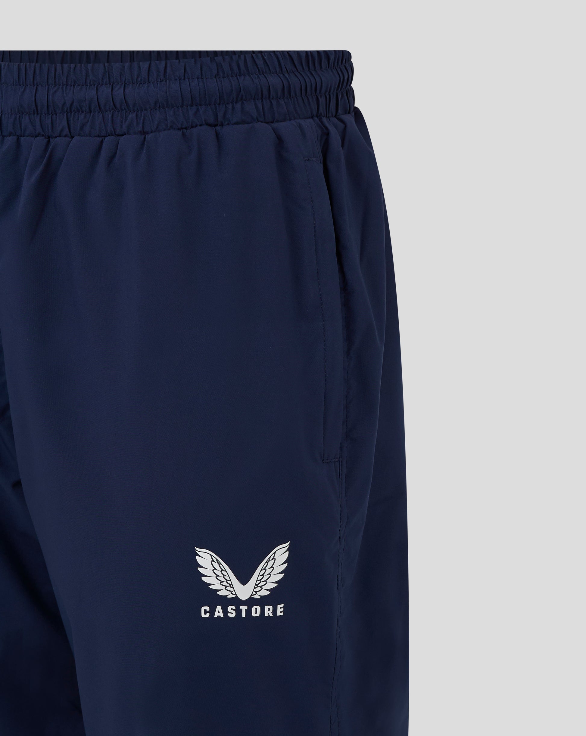 Castore logo with wings on navy rugby pant leg