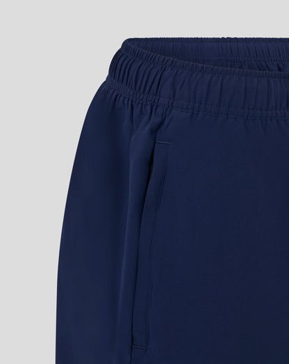 Close-up of navy woven training shorts waistband with elastic and topstitching
