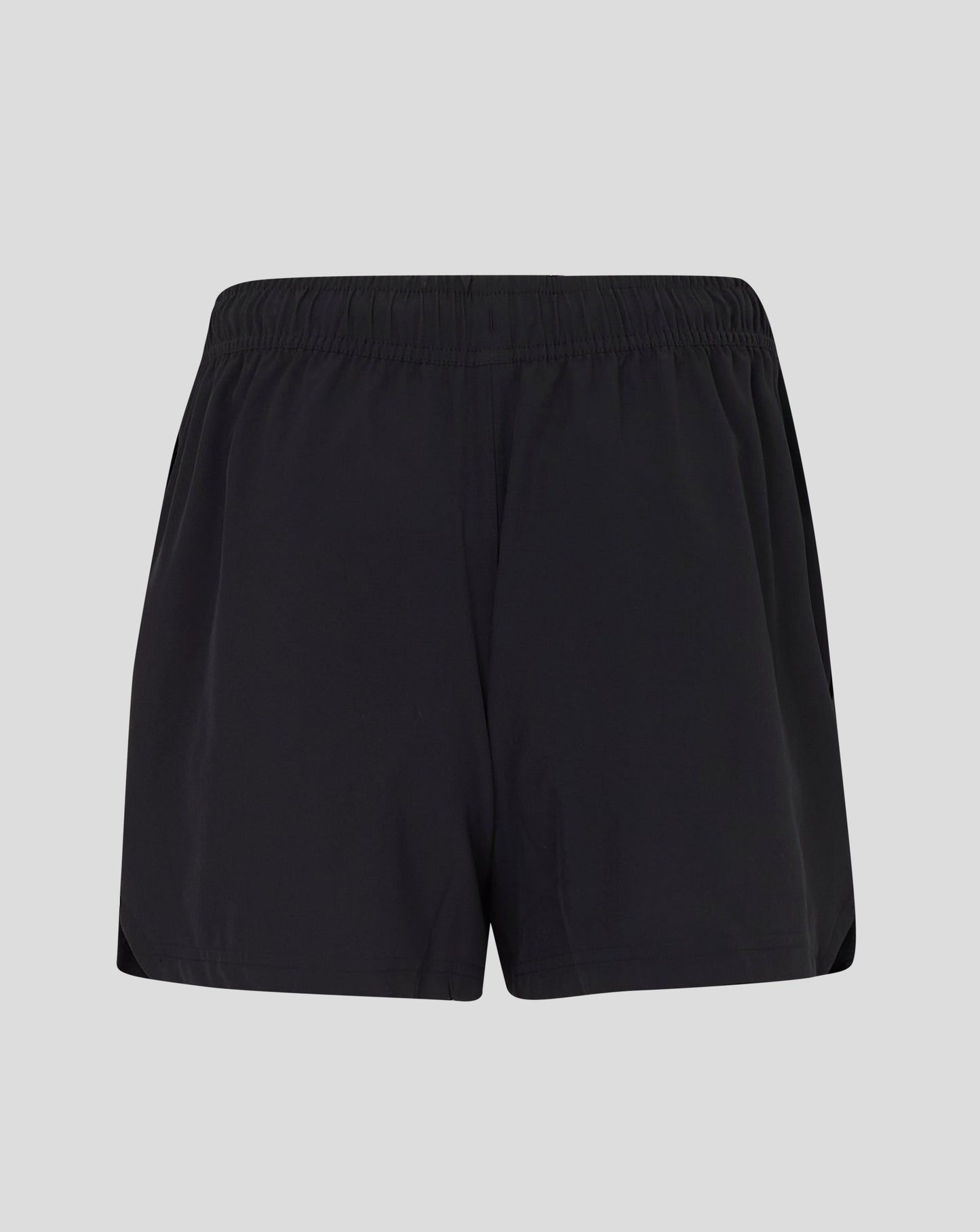 Front view of black woven training shorts with Castore logo at lower left leg