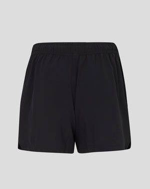 Front view of black woven training shorts with Castore logo at lower left leg