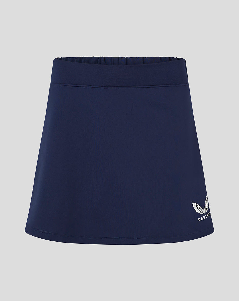 Navy womens skort with flat front and built in brief Castore logo at lower right