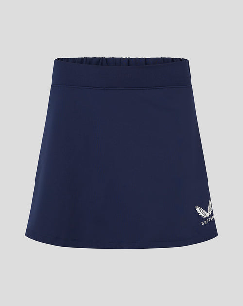 Navy womens skort with flat front and built in brief Castore logo at lower right
