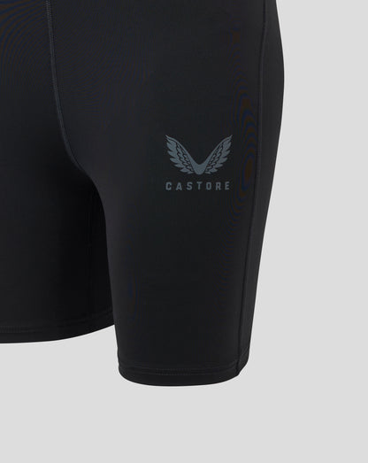 Womens Baselayer Short in black Caviar shown on the leg with a Castore logo and visible flatlock seams