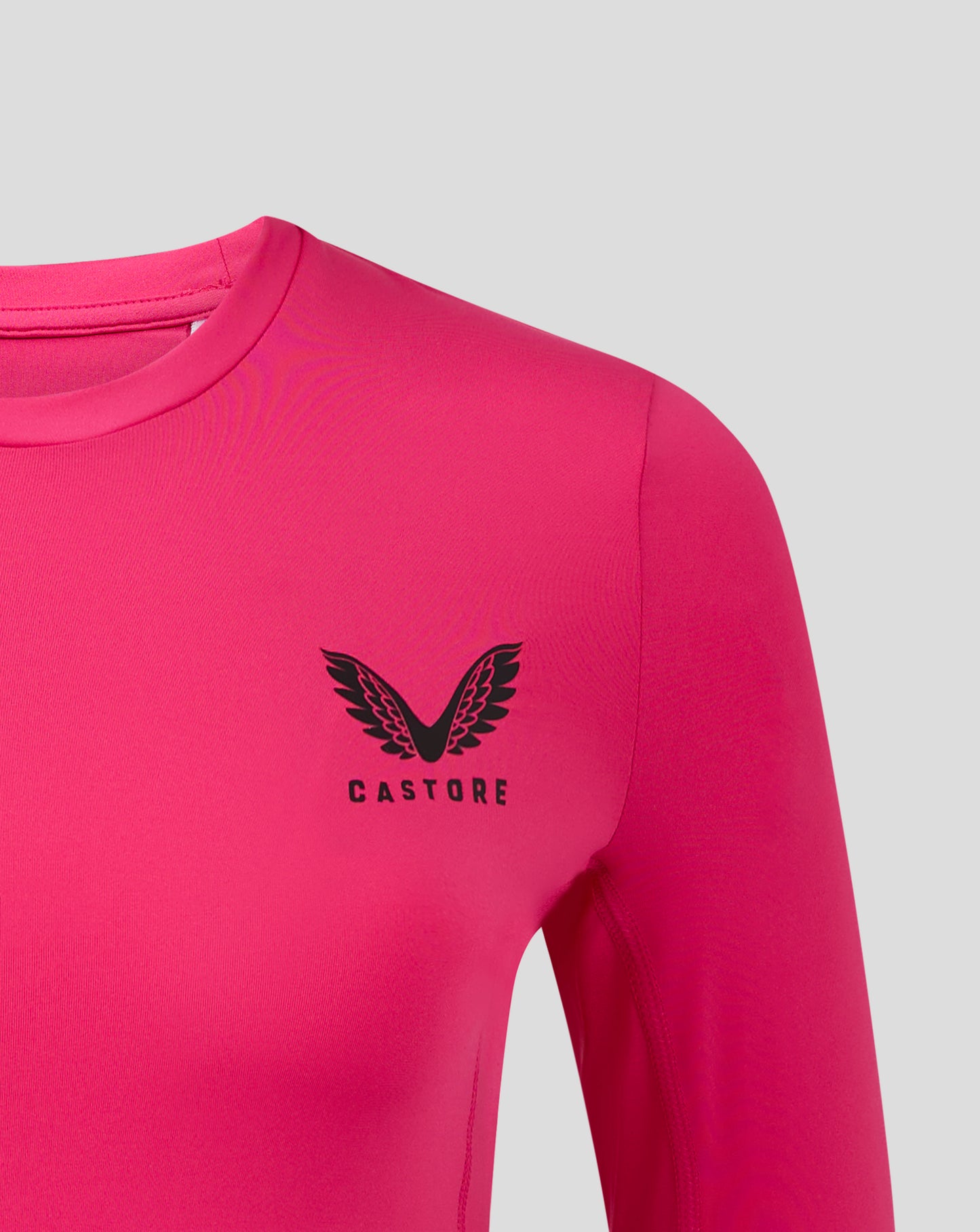 Close up of shoulder and neckline on Beetroot Purple baselayer top with Castore logo
