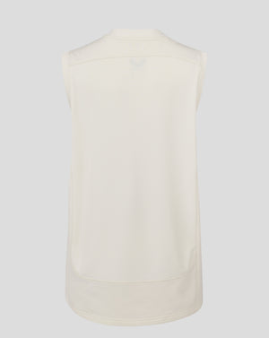 Back view of Cannoli Cream sleeveless cricket jumper with mesh back panel
