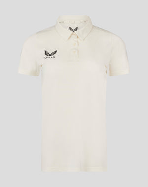 Womens Cricket Tech Playing Shirt Cannoli Cream front view with three button placket and Castore logo