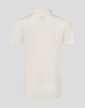 Back view of Cannoli Cream cricket shirt showing curved hem and small Castore logo at upper back