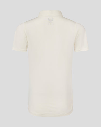Back view of Cannoli Cream cricket shirt showing curved hem and small Castore logo at upper back