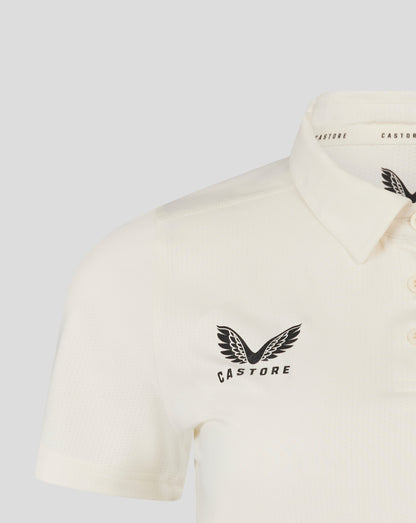Cannoli Cream womens cricket tech playing shirt close up showing 3 button placket and Castore logo on chest