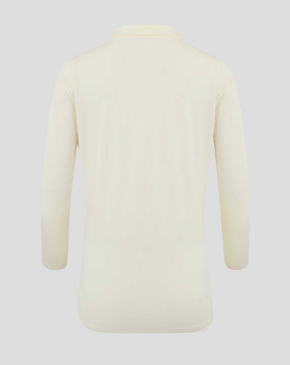Back view of Cannoli Cream long sleeve cricket tech playing shirt in cream showing clean rear panel