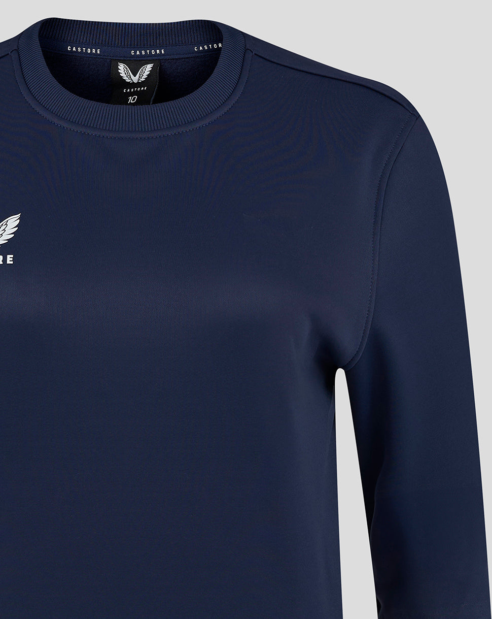 Close-up of the crew neckline and upper chest showing the heat sealed Castore logo.