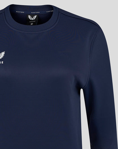 Close-up of the crew neckline and upper chest showing the heat sealed Castore logo.