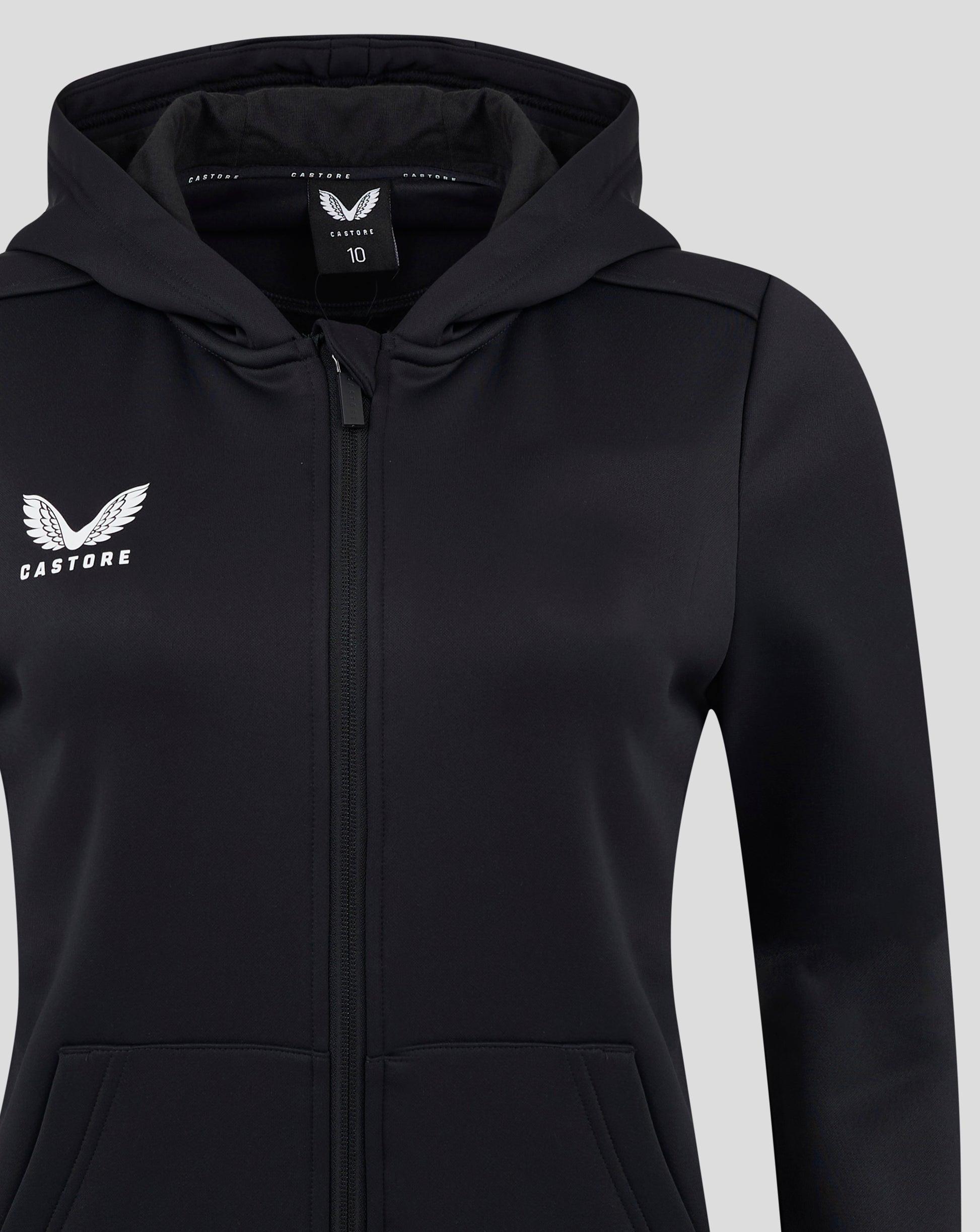 Close up of black Castore hoodie showing the chest logo and interior hood label.