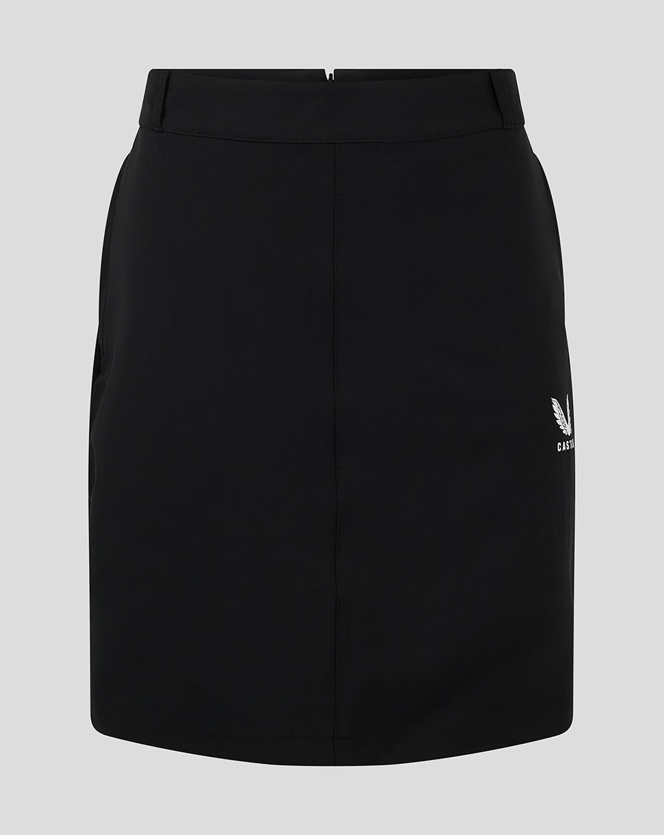 Front view of black women's chino skirt with white Castore logo at the hem