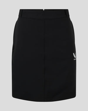 Front view of black women's chino skirt with white Castore logo at the hem