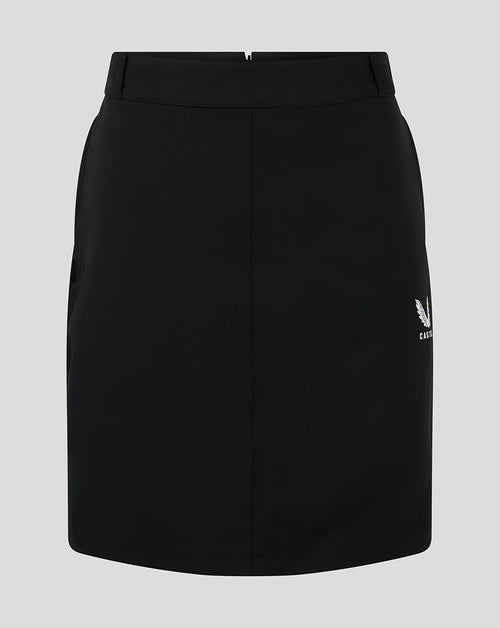Front view of black women's chino skirt with white Castore logo at the hem