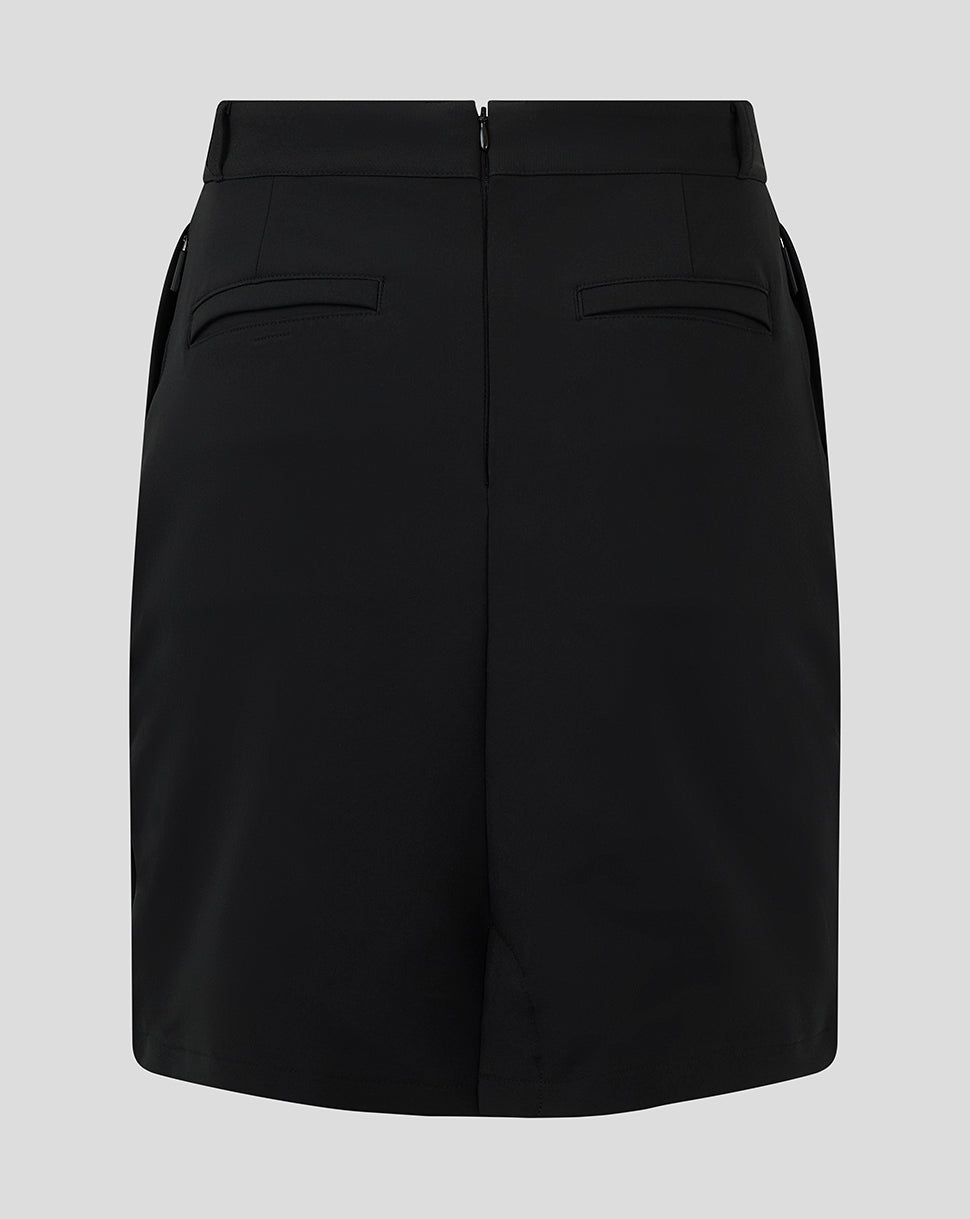 White winged Castore logo on black skirt near the hip