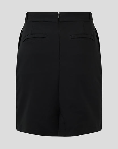 White winged Castore logo on black skirt near the hip