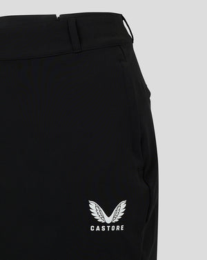 Close-up of waistband with belt loops and back zipper on black chino skirt