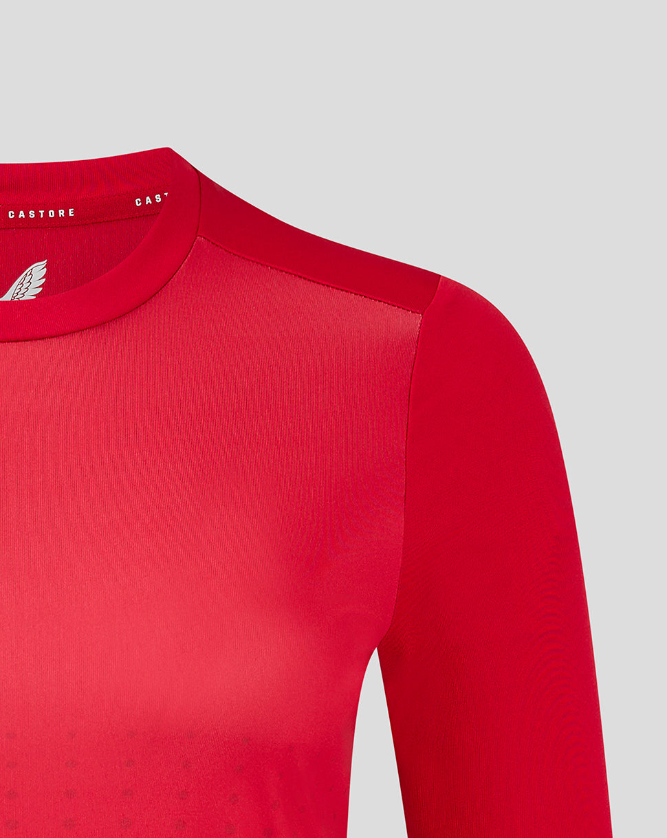 Close up of gradient printed red long sleeve training tee showing shoulder seam