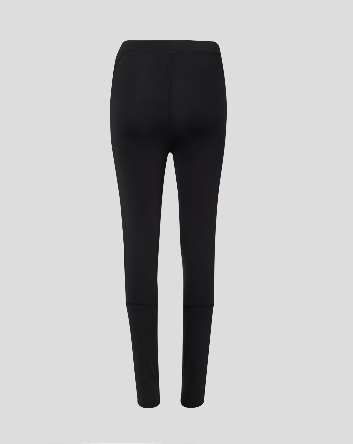Back view of black Baselayer Legging highlighting self fabric folded waistband and flatlock seams