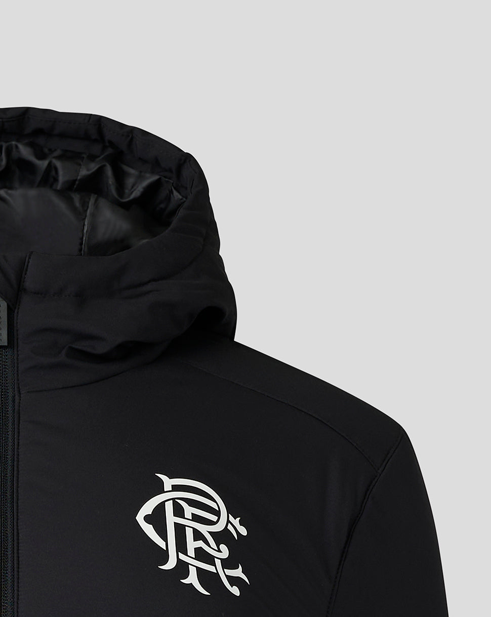 Chest detail of the jacket with a blue side panel and a zipper pull marked Castore on dark fabric.