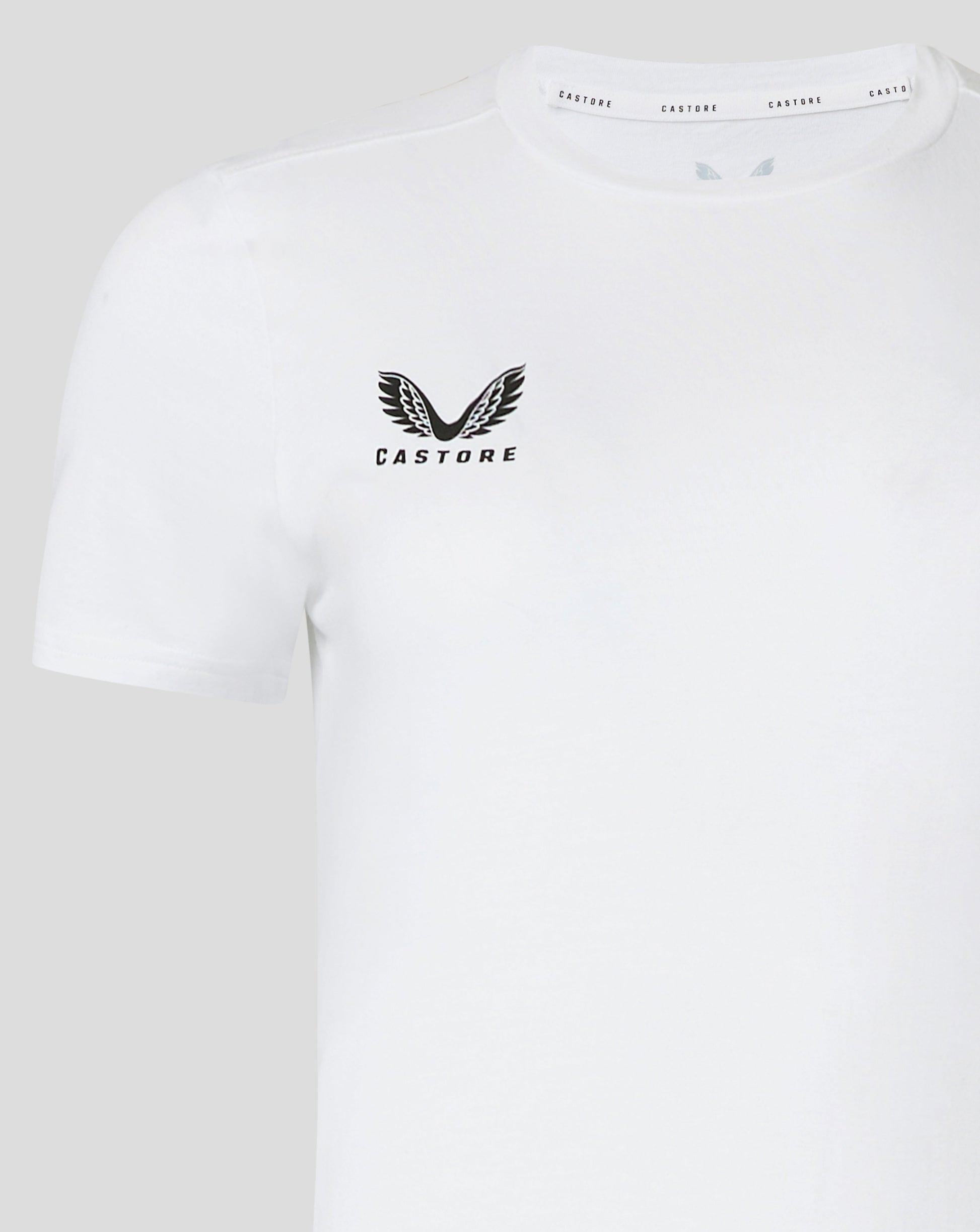 White cotton leisure tee featuring a black winged Castore emblem on the left chest and Castore branding along the collar trim.