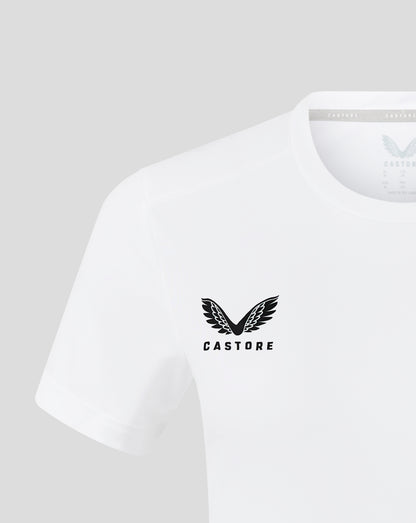 Close up of white womens performance tee showing crew neck and forward shoulder seam with heat sealed Castore logo.