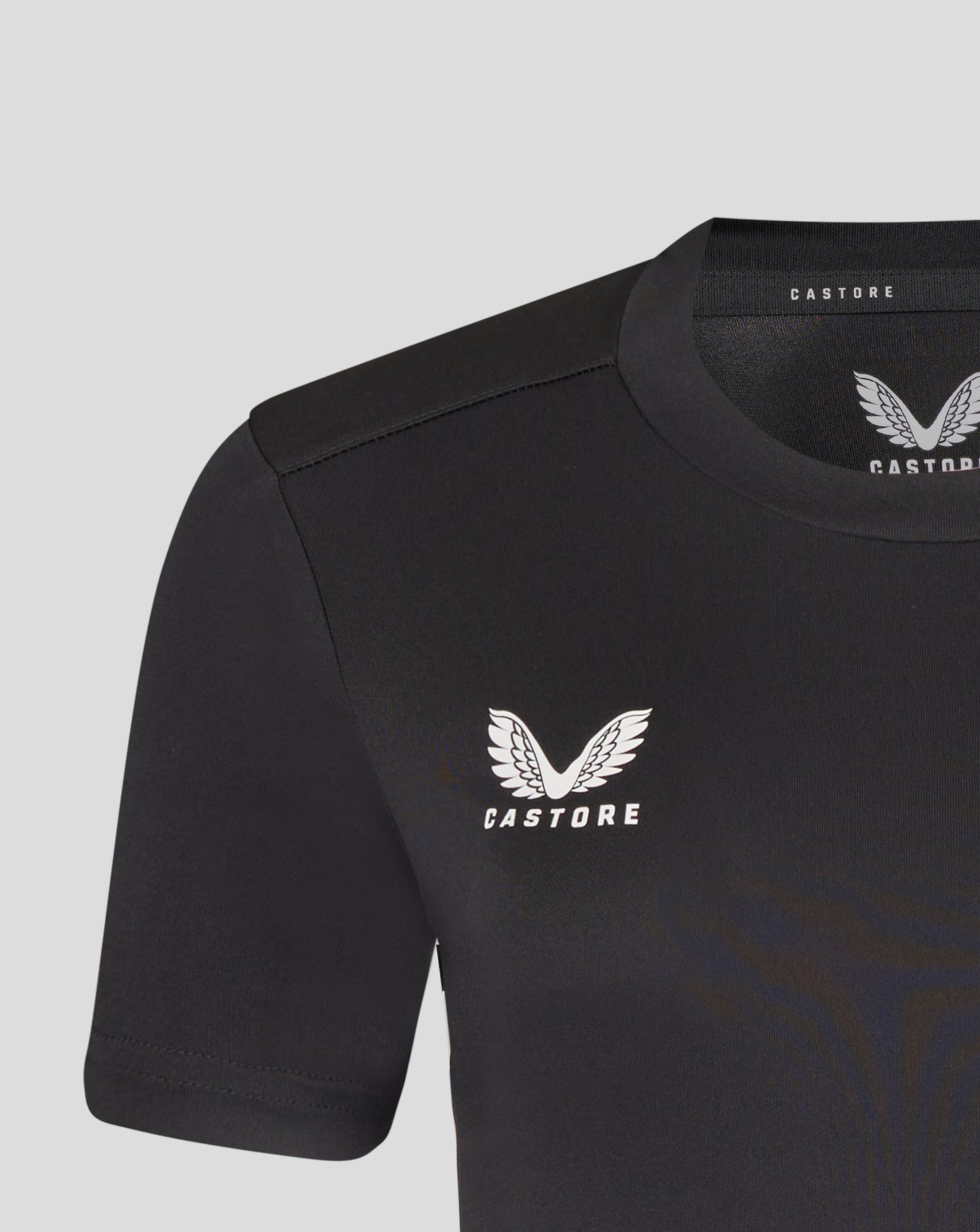 Close up of black Leicester Tigers training T shirt neckline with Castore branding and wing logo