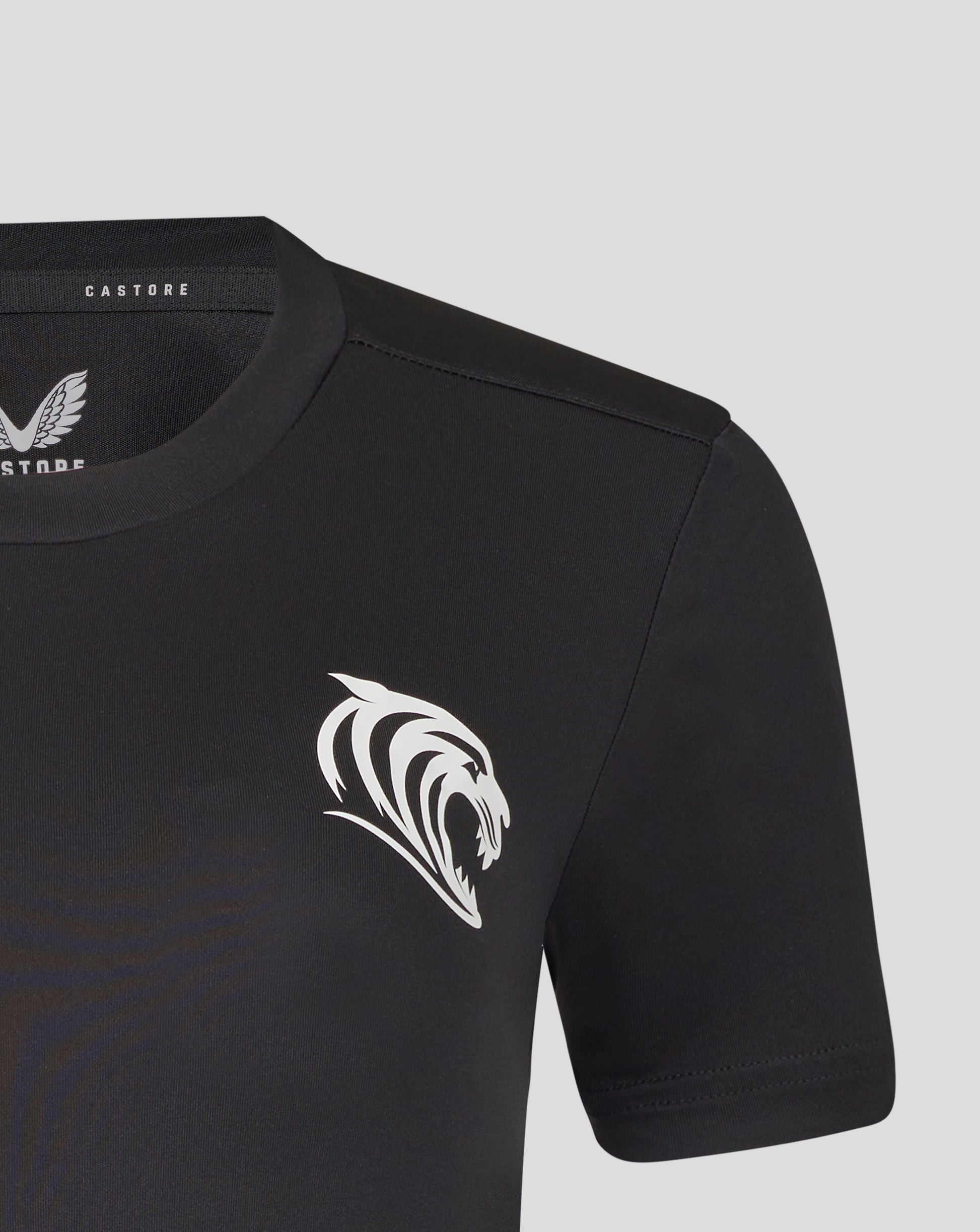 Close up of the black training T shirt neckline showing Castore label and a large white tiger crest on the chest