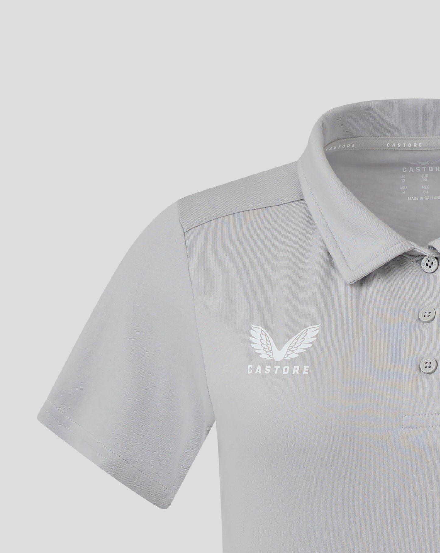 Close up of front chest on light gray Women's Cotton Leisure Polo with white Castore wings logo