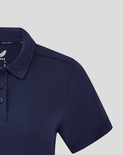 Close view of navy women's polo sleeve and shoulder showing seam and fabric texture