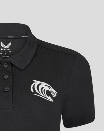 Leicester Tigers women's training polo in black featuring a large white tiger graphic across the front
