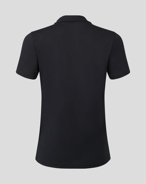 Back view of black cotton leisure polo with short sleeves and heat sealed Castore logo near the collar.