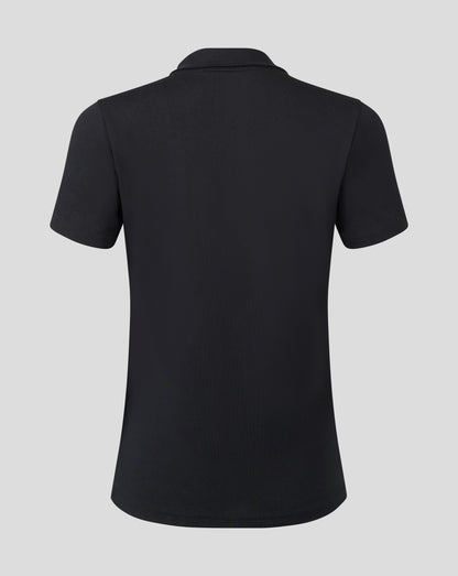 Back view of black cotton leisure polo with short sleeves and heat sealed Castore logo near the collar.