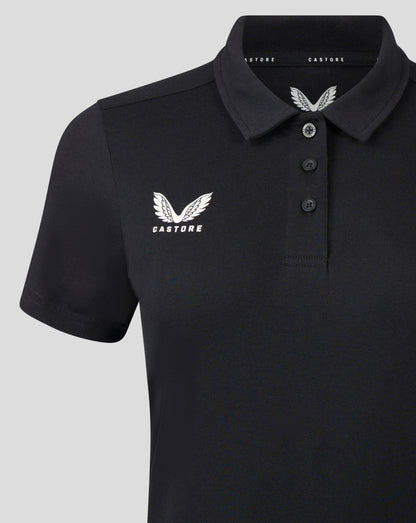Front close up of black polo showing self fabric collar three button placket and white Castore logo on chest.