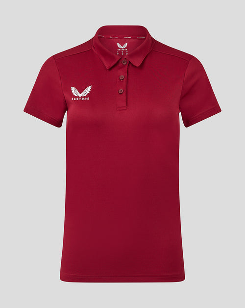 Front view of red Womens Performance Polo with self fabric collar three button placket and Castore logo