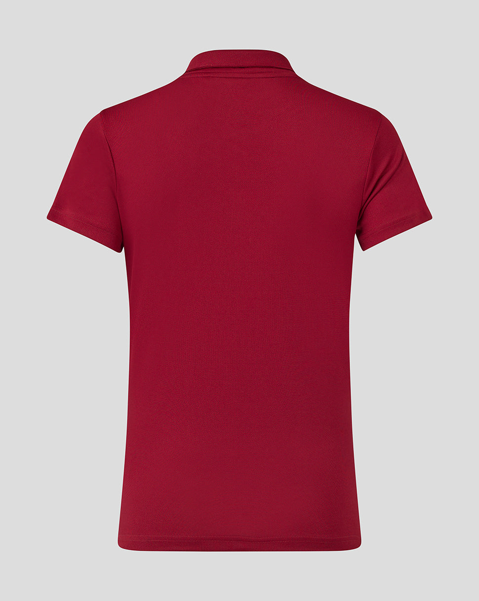 Back view of red Womens Performance Polo showing plain back and short sleeves