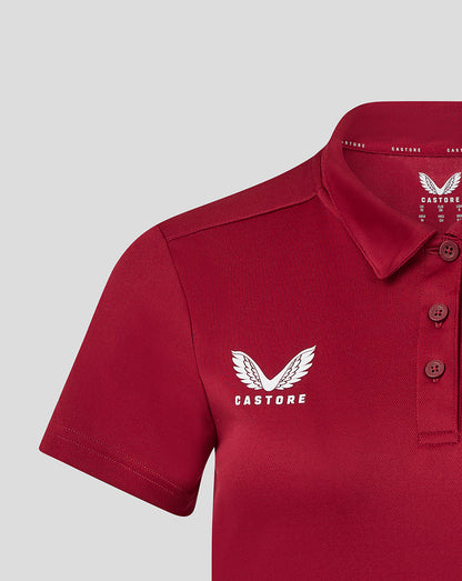 Womens performance polo in biking red with three button placket and Castore logo on chest