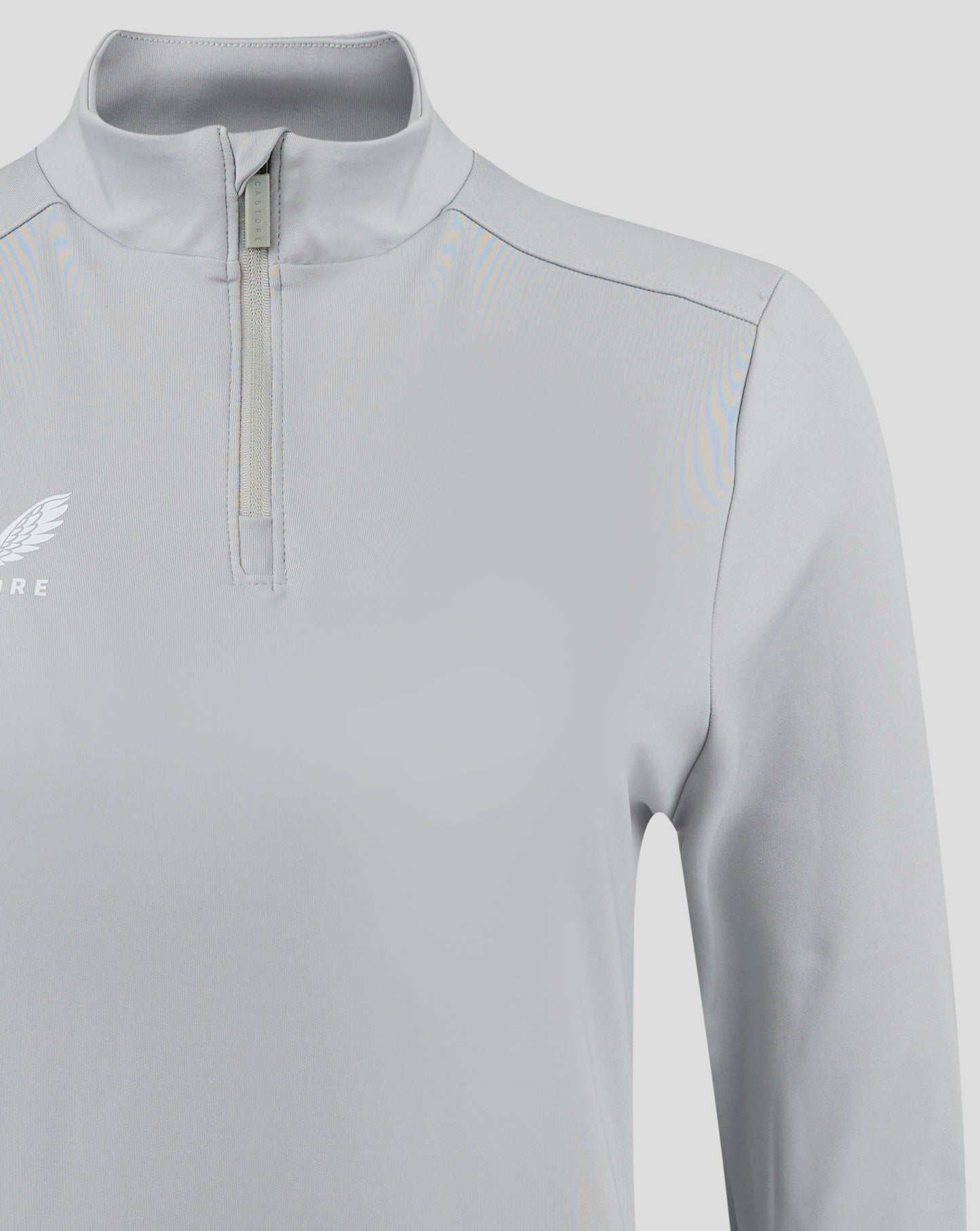 Close up of collar and front zip on light gray Castore top showing zipper pull and placket