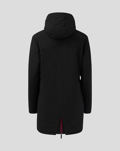 Back view of black long staff jacket with hood and burgundy zipper trim.