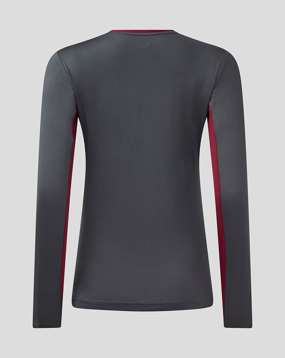 Back view of a women's Aston Villa Coaches Training long sleeve tee in ebony with rhododendron side panels