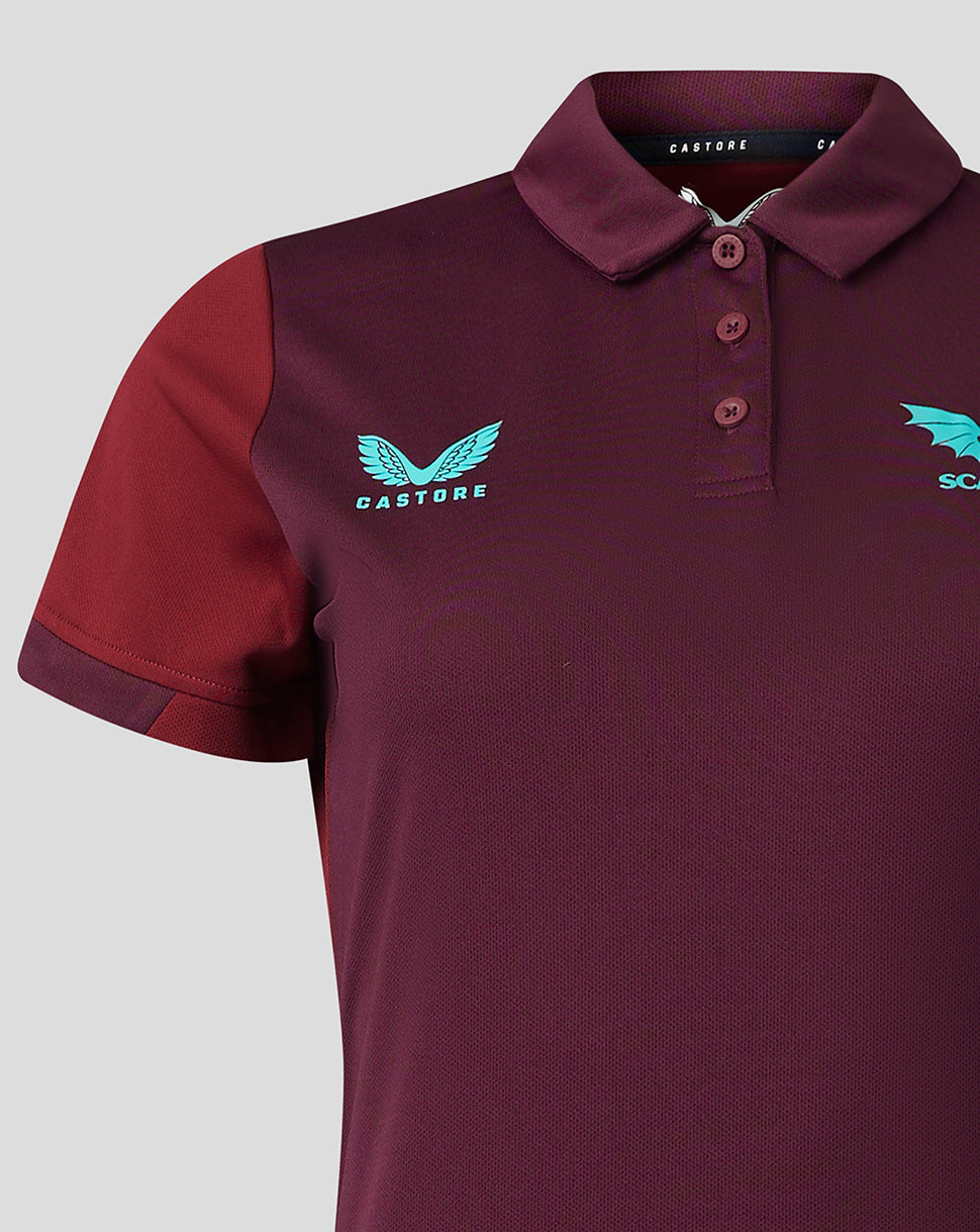 Detail of burgundy Scarlets polo with turquoise left chest crest and contrasting sleeve cuff.