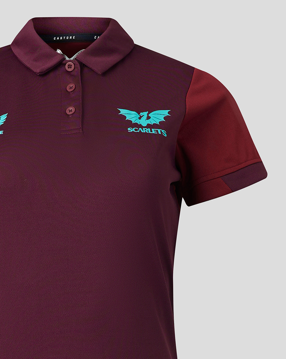 Close-up of burgundy Scarlets travel polo showing collar, three-button placket and turquoise crest on the left chest.